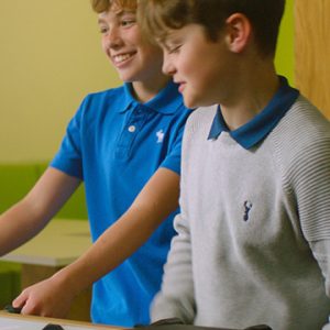 Students playing together in the boarding room facility area