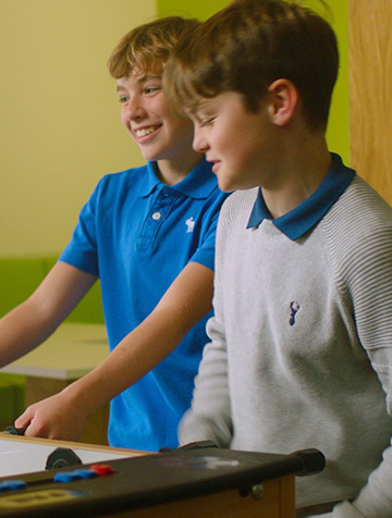 Students playing together in the boarding room facility area