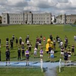 students standing spaced out on a pitch