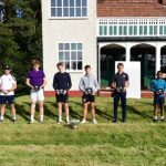 boys holding trophies