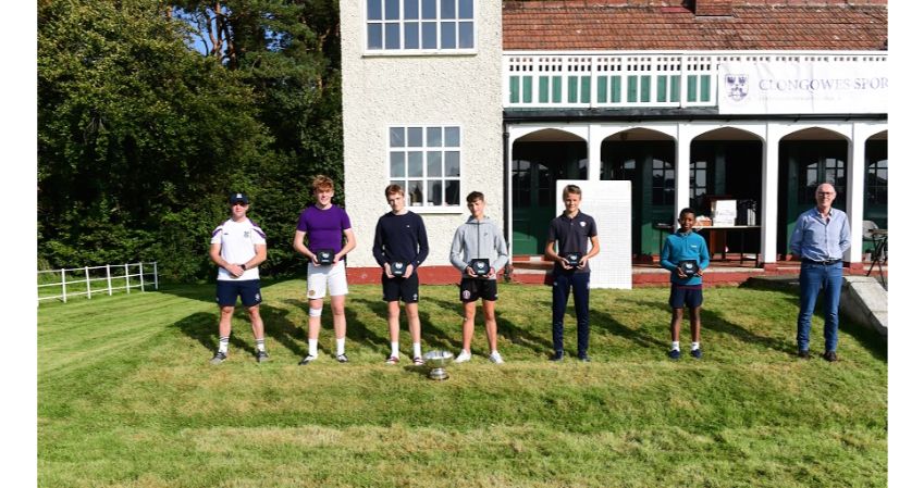 boys holding trophies