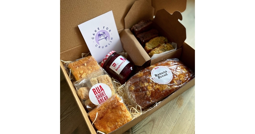 cardboard box full of cake and jam