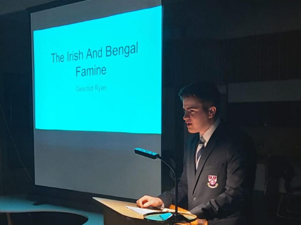 boy delivering an assembly in a dark hall