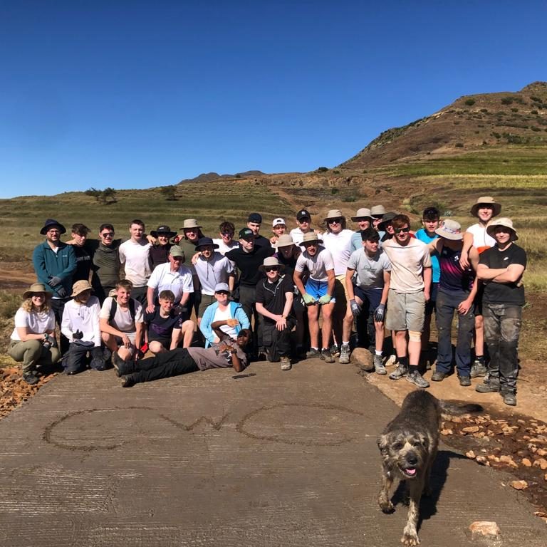 Group of students with a dog, in Lesotho