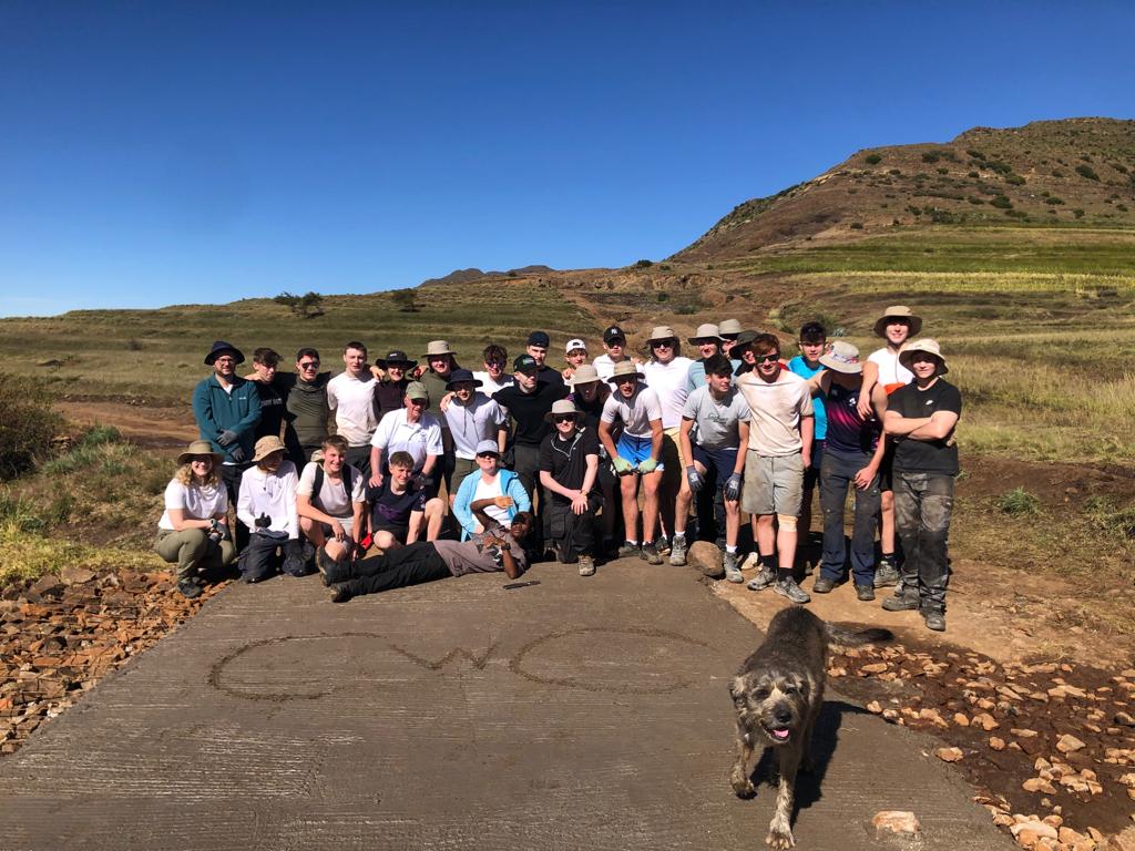 Group of students with a dog, in Lesotho